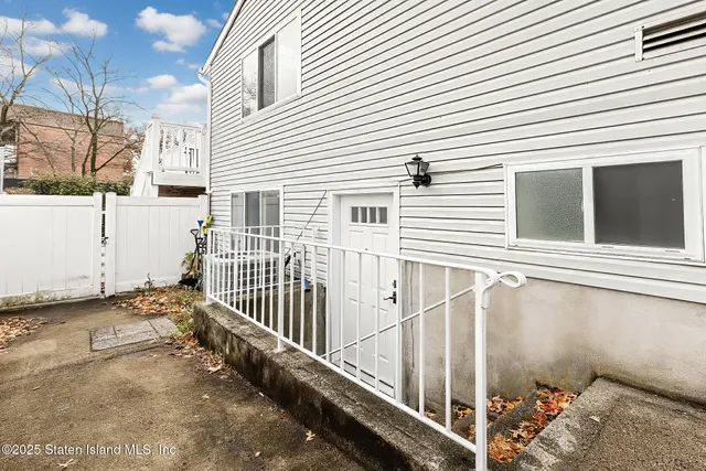a view of a house with a small yard