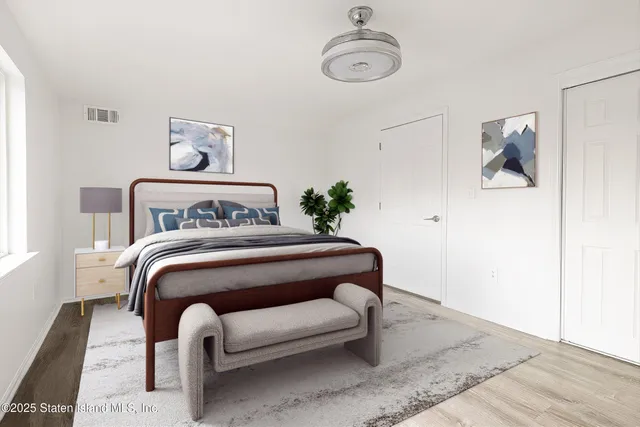 a bedroom with a bed and a table