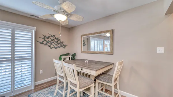 a dining room with a table and chairs