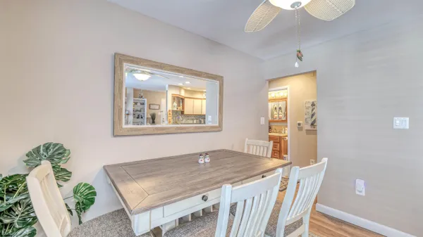 a bathroom with a toilet a sink and a window