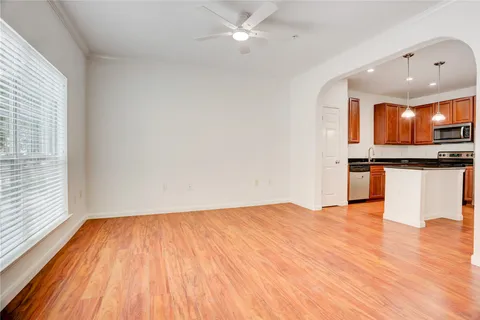 a view of kitchen with microwave and cabinets