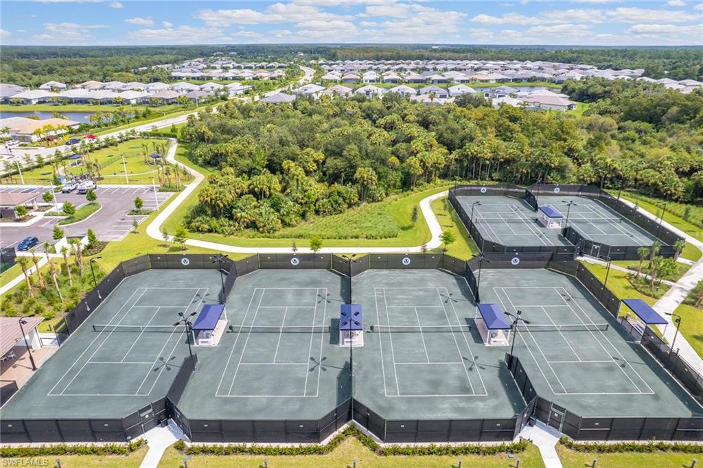 12100 Eucalyptus Way Naples, FL 34120 - Photo 32 of 36 a view of a swimming pool with a yard