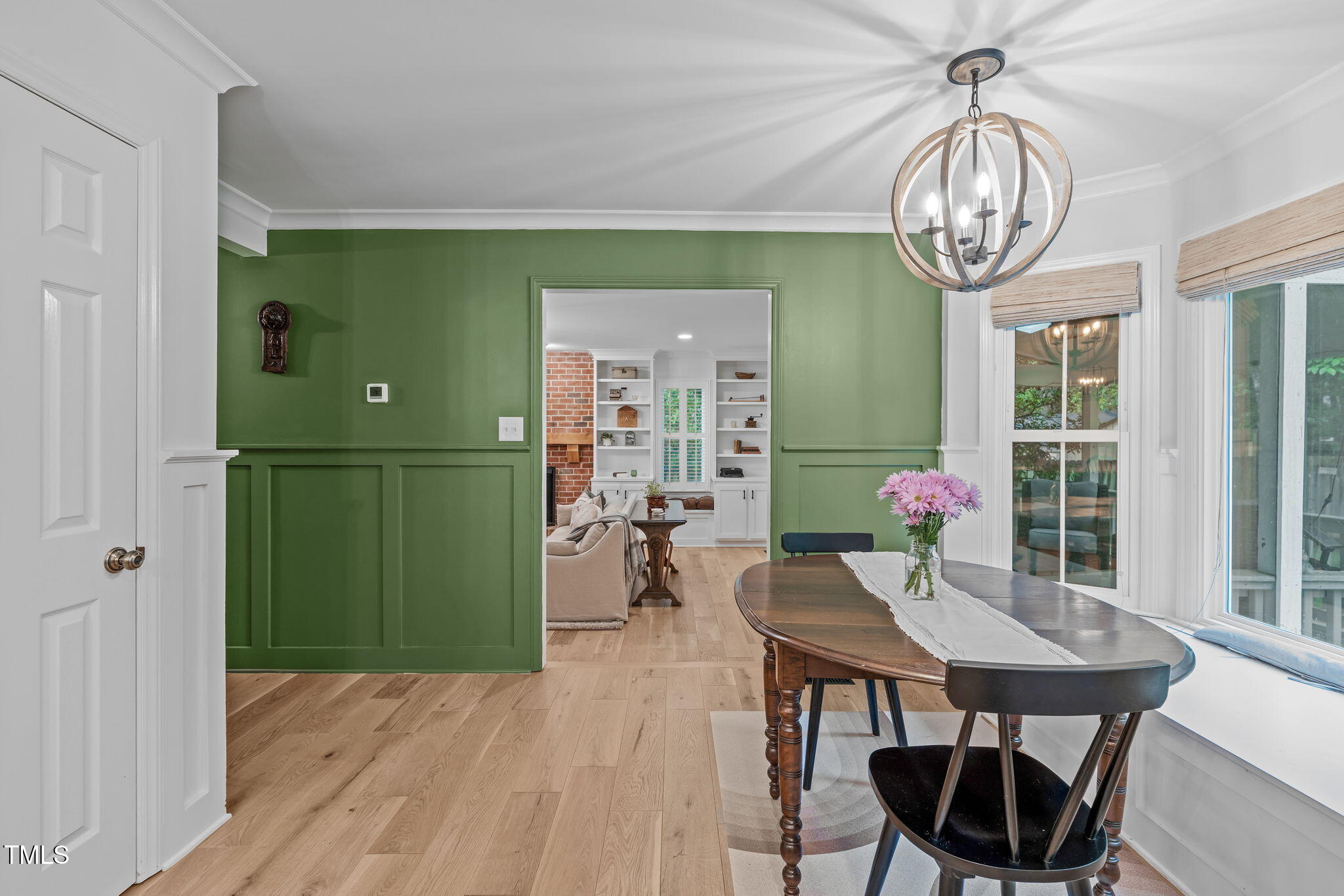 8505 Stonegate Drive Raleigh, NC 27615 - Photo 11 of 32 a view of a dining room with furniture window and wooden floor
