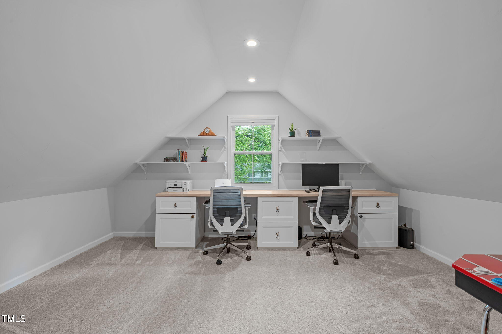 8505 Stonegate Drive Raleigh, NC 27615 - Photo 20 of 32 a view of a workspace with furniture and a window