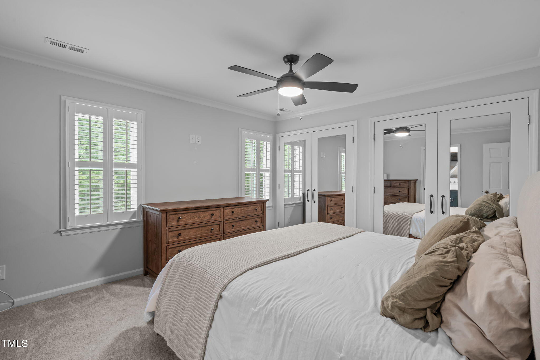 8505 Stonegate Drive Raleigh, NC 27615 - Photo 23 of 32 a bedroom with a large bed and window