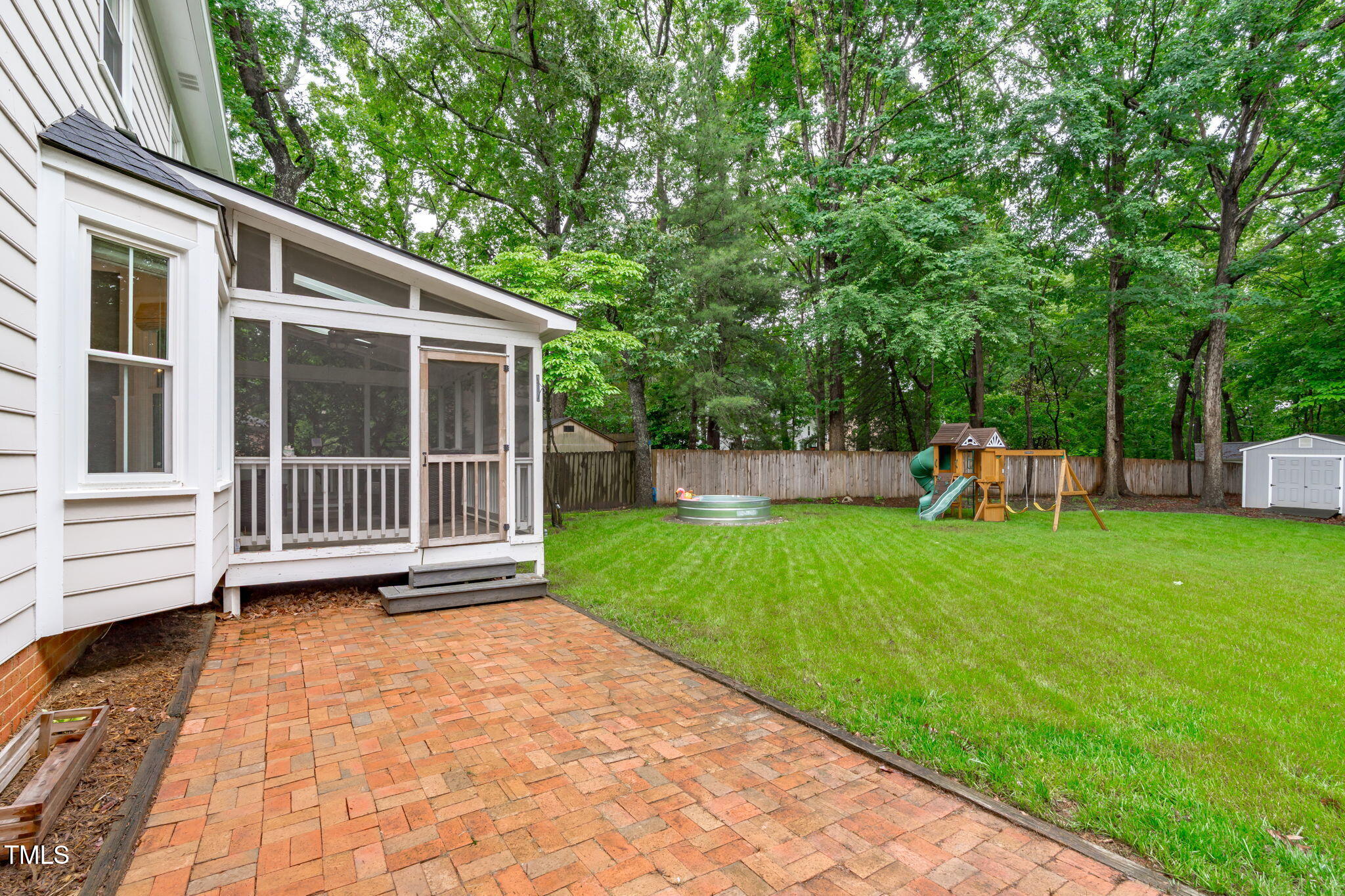 8505 Stonegate Drive Raleigh, NC 27615 - Photo 27 of 32 a view of a house with backyard and a garden