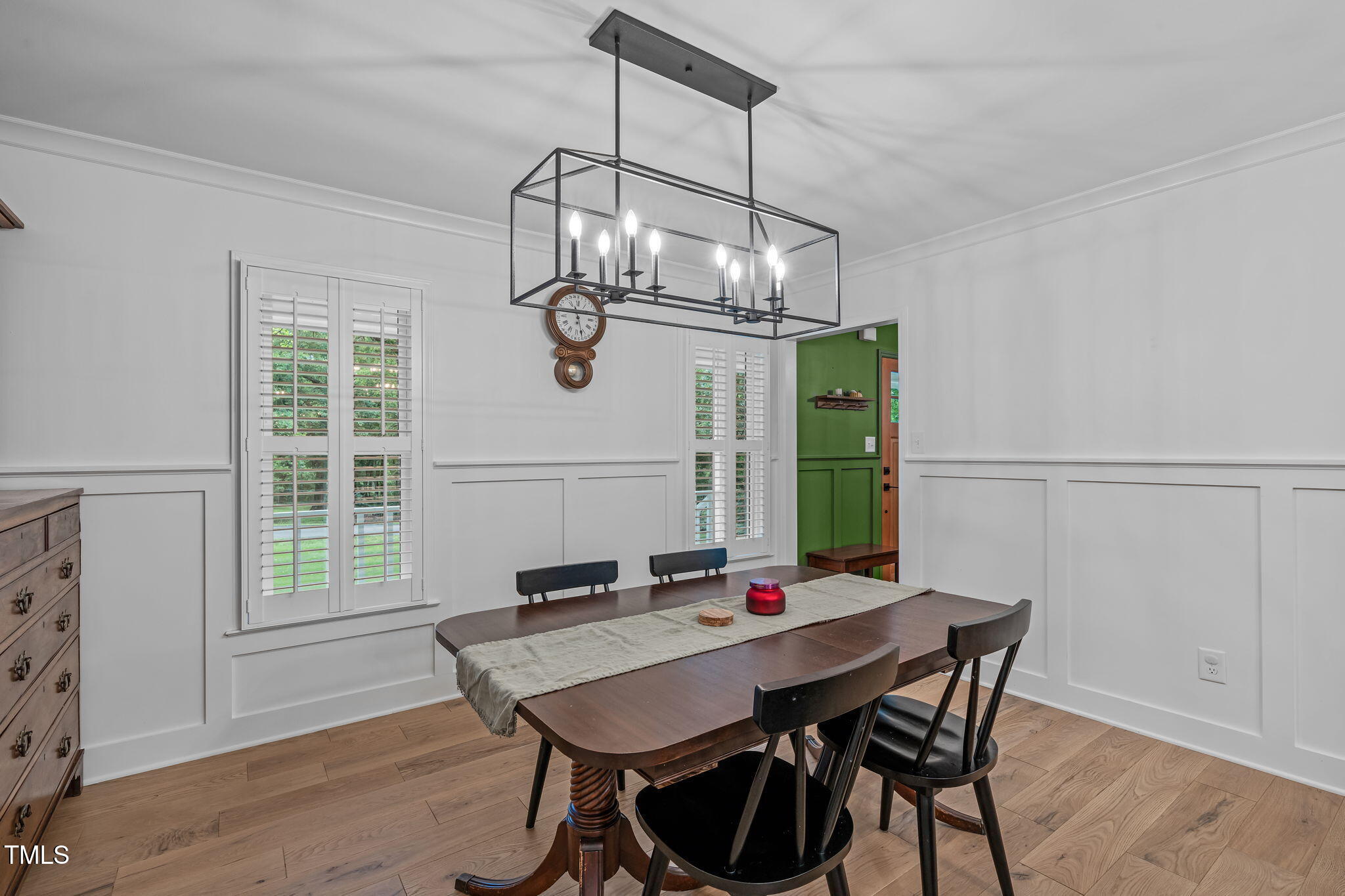 8505 Stonegate Drive Raleigh, NC 27615 - Photo 6 of 32 a view of a dining room with furniture window and wooden floor