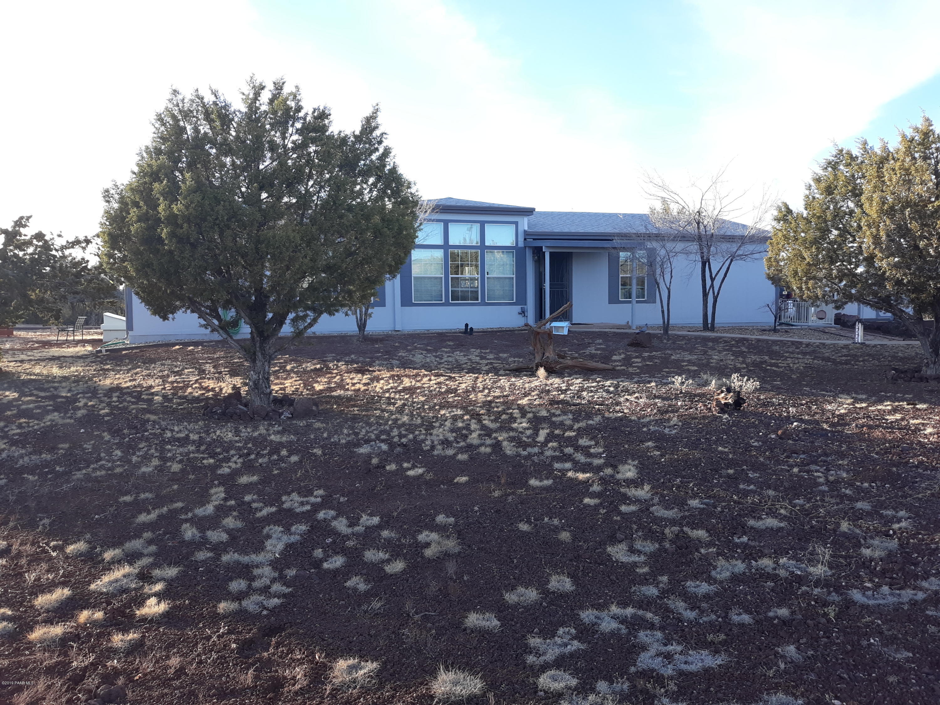 3258 Double A Ranch Road Williams, AZ 86046 - Photo 1 of 32 a view of a house with a yard