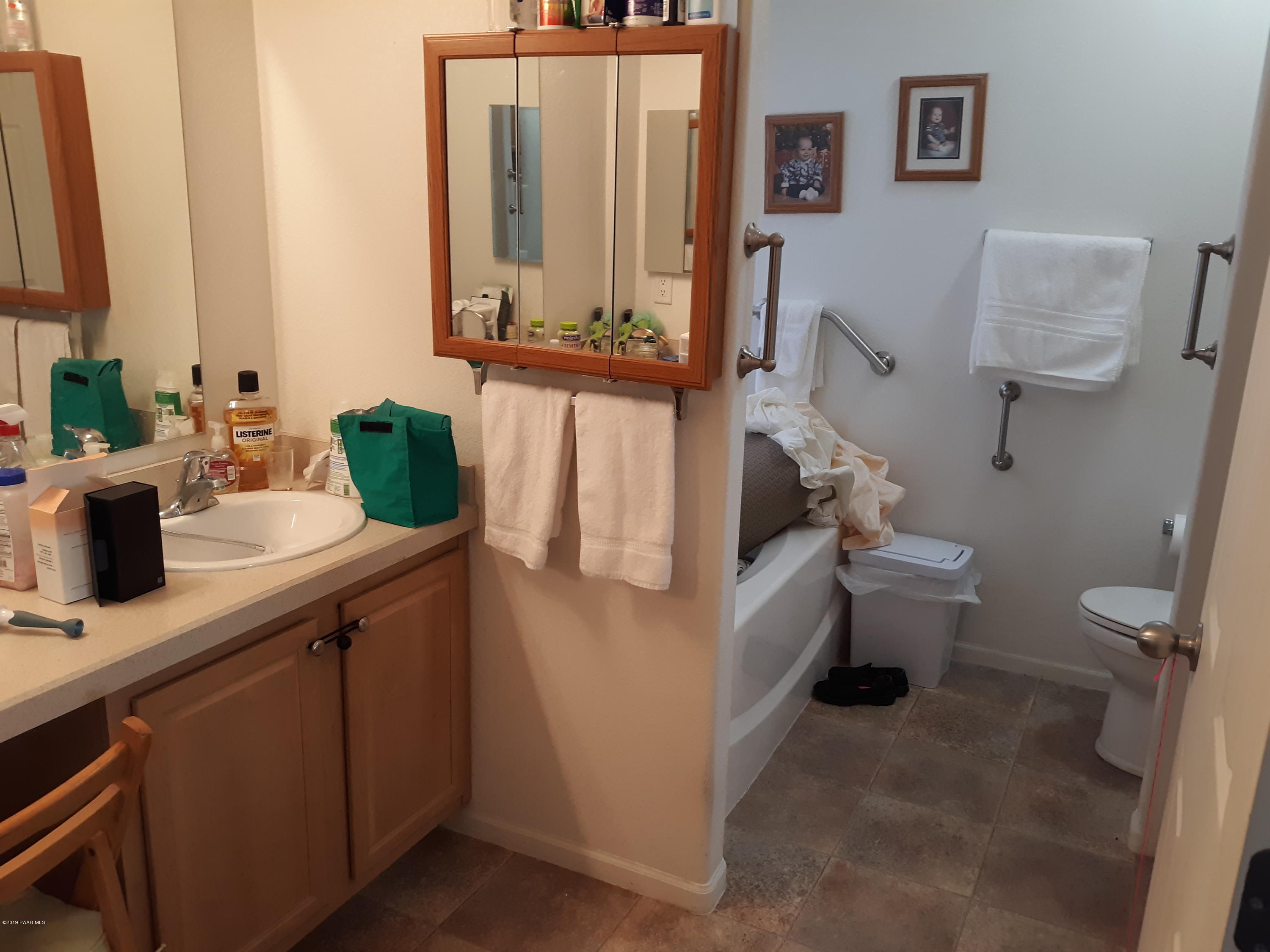 3258 Double A Ranch Road Williams, AZ 86046 - Photo 21 of 32 a bathroom with a toilet sink and mirror
