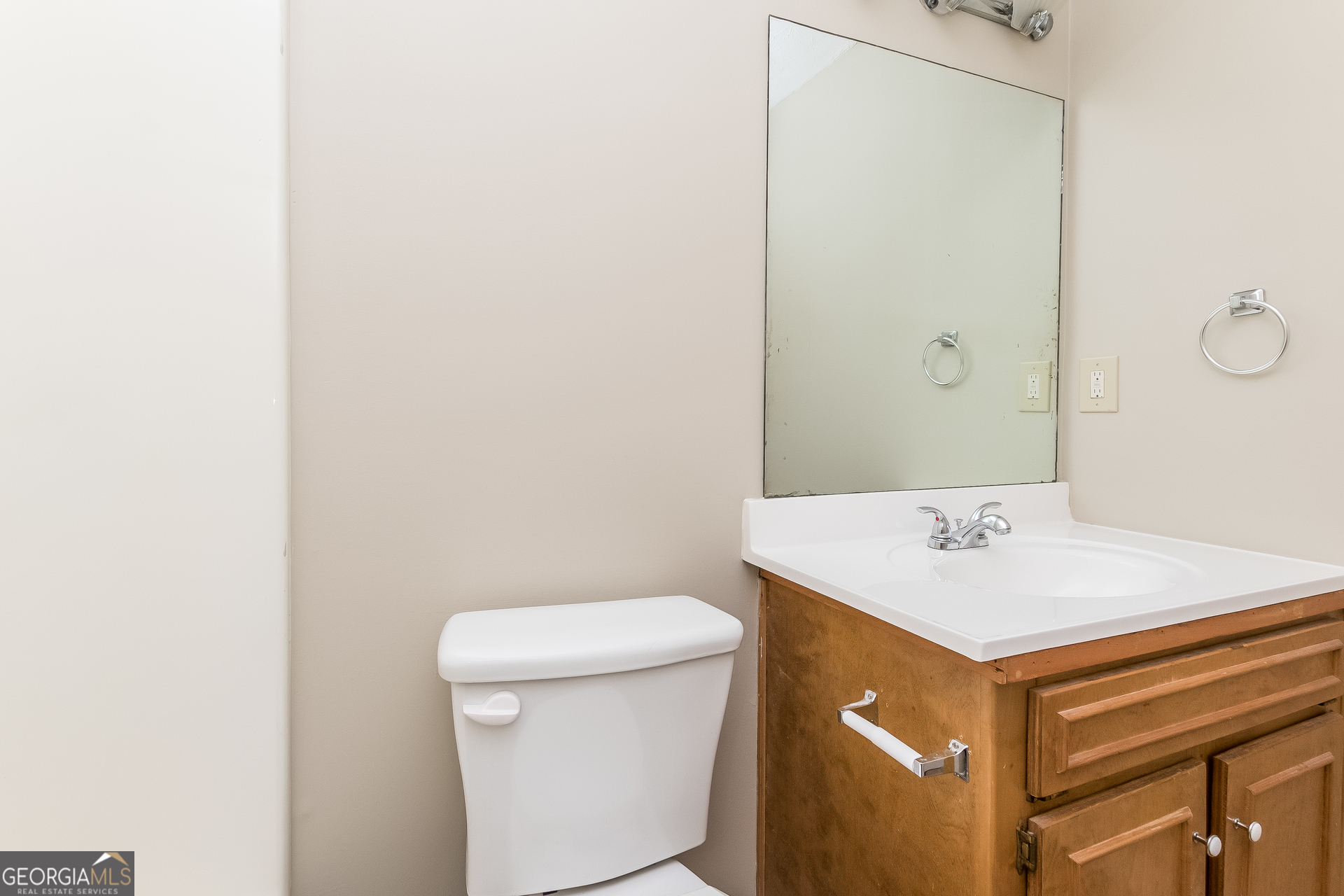 1038 Summer Place Northwest Acworth, GA 30102 - Photo 13 of 15 a bathroom with a sink a toilet and a mirror