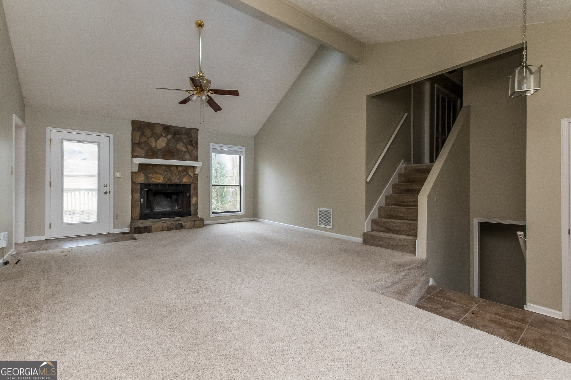 1038 Summer Place Northwest Acworth, GA 30102 - Photo 2 of 15 an empty room with fireplace entryway and windows