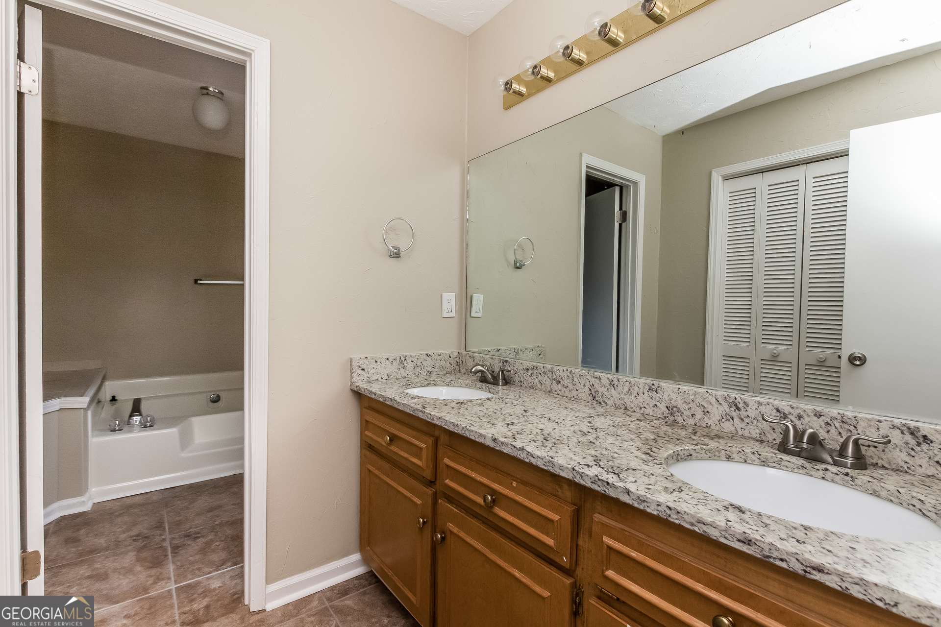 1038 Summer Place Northwest Acworth, GA 30102 - Photo 8 of 15 a bathroom with a granite countertop sink and a mirror