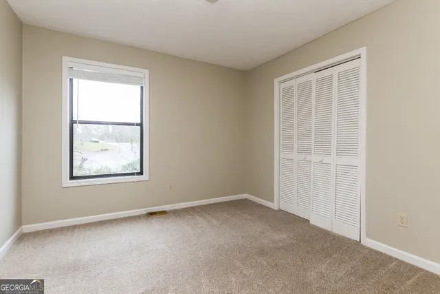 an empty room with windows