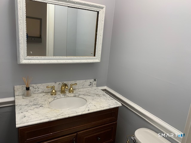 50 Glenbrook Road, Unit 5G Stamford, CT 06902 - Photo 32 of 40 a bathroom with a sink and a mirror