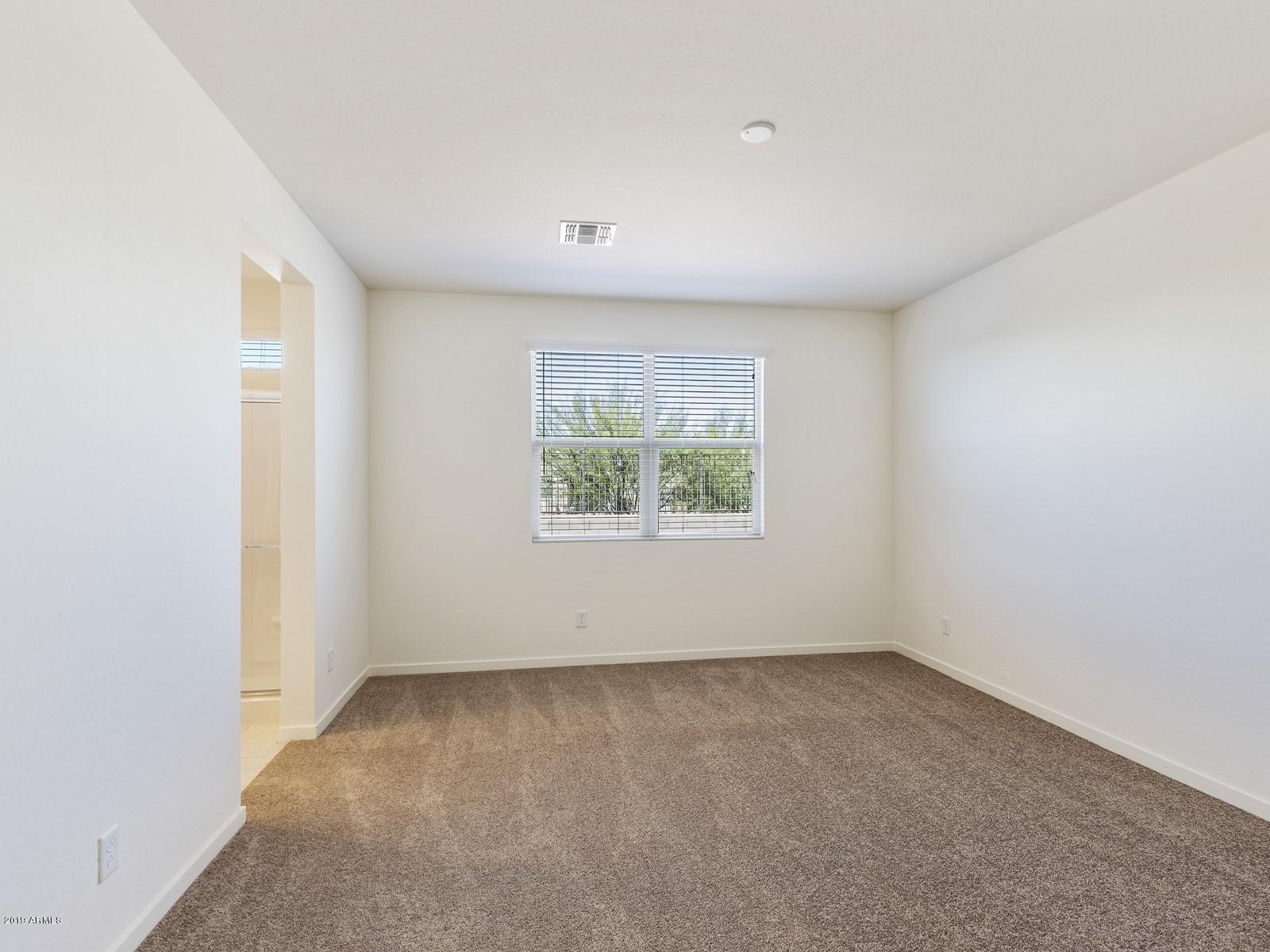 9822 West Trumbull Road Tolleson, AZ 85353 - Photo 7 of 15 009_Master Suite
