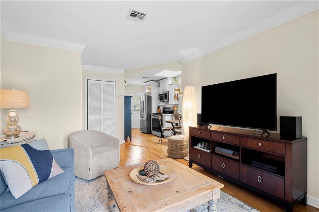 1879 Johnson Road Northeast, Unit 5 Atlanta, GA 30306 - Photo 6 of 28 a living room with furniture and a flat screen tv