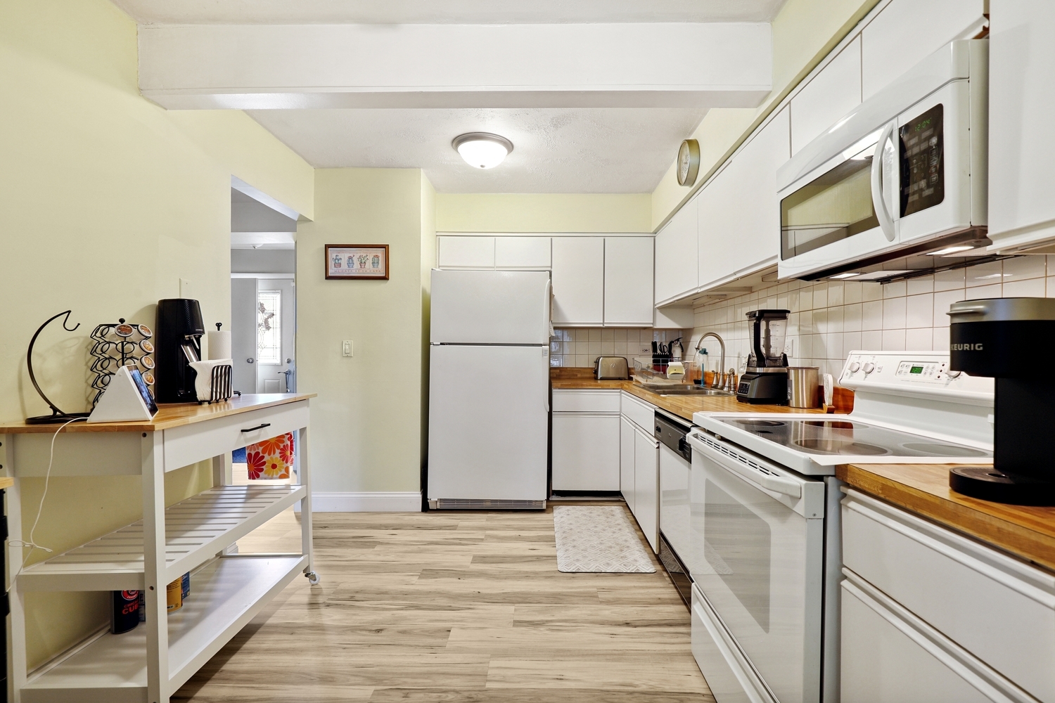 179 Roberts Road Bolingbrook, IL 60440 - Photo 6 of 20 a kitchen with kitchen island a sink appliances cabinets and a counter space