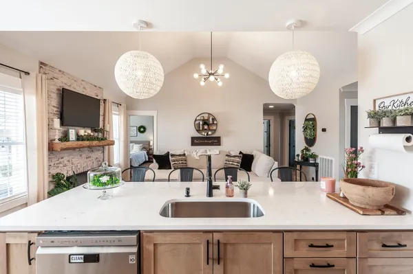 a kitchen with a table and a clock on the wall