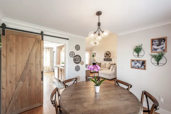 a living room with furniture and a table