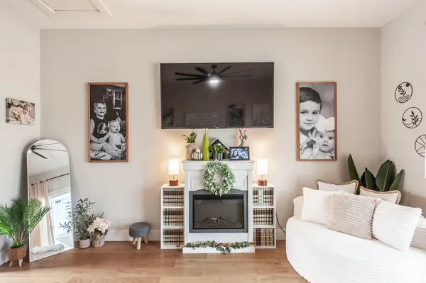 a living room with furniture and a flat screen tv