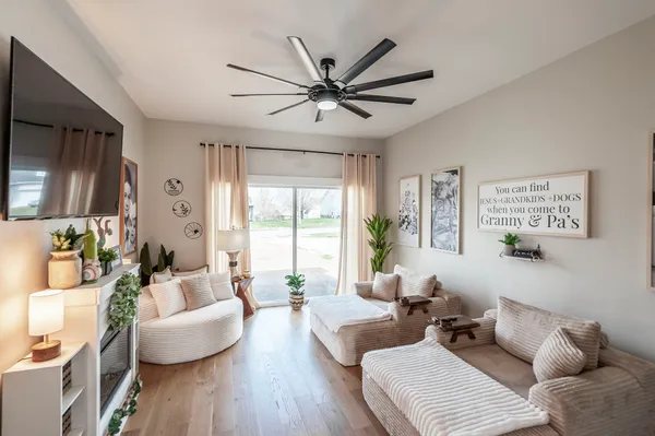 a living room with furniture and a large window