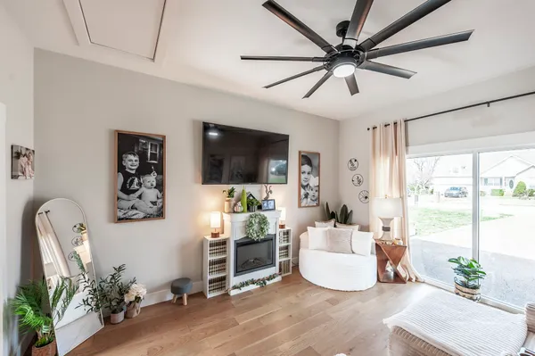 a living room with furniture and a flat screen tv