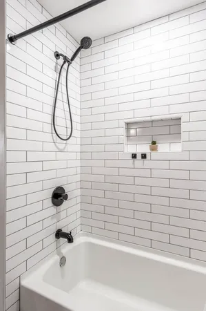 a bathroom with a shower and a bathtub