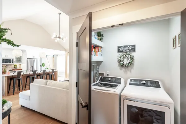 a living room with dryer and washer