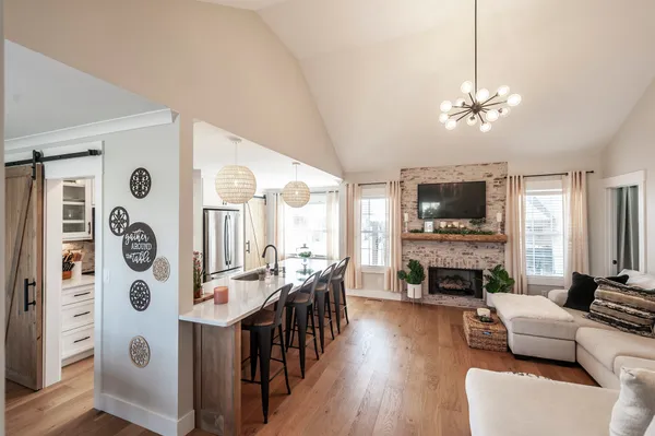 a living room with furniture fireplace and flat screen tv