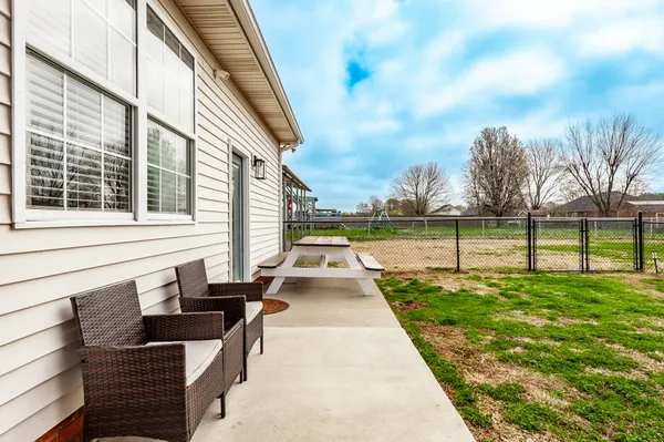 a view of swimming pool with seating area