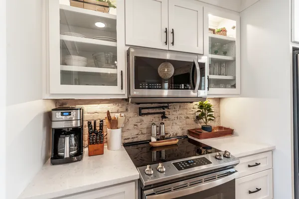 a kitchen with a stove and cabinets