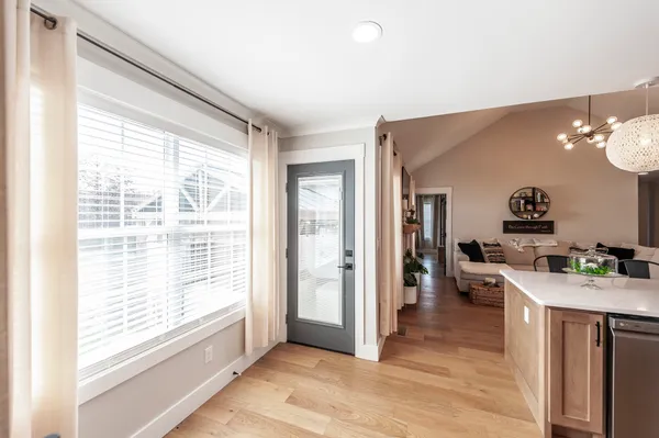 a kitchen with a stove a refrigerator and a sink