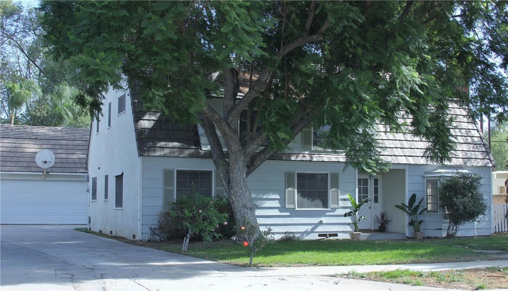 4927 Rodeo Road Riverside, CA 92504 - Photo 1 of 1 front view of house with a yard