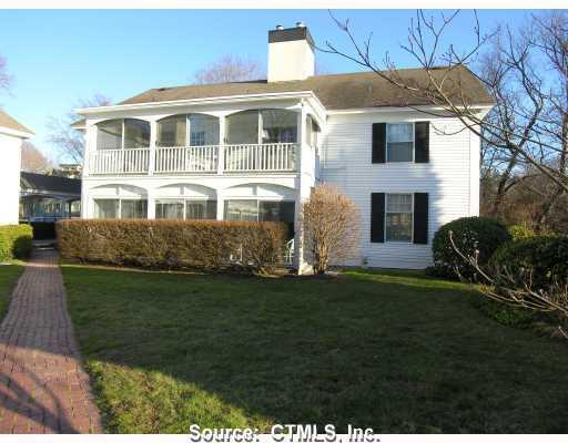 14 Ferry Road, Unit A1 Old Lyme, CT 06371 - Photo 1 of 1 a front view of a house with a garden