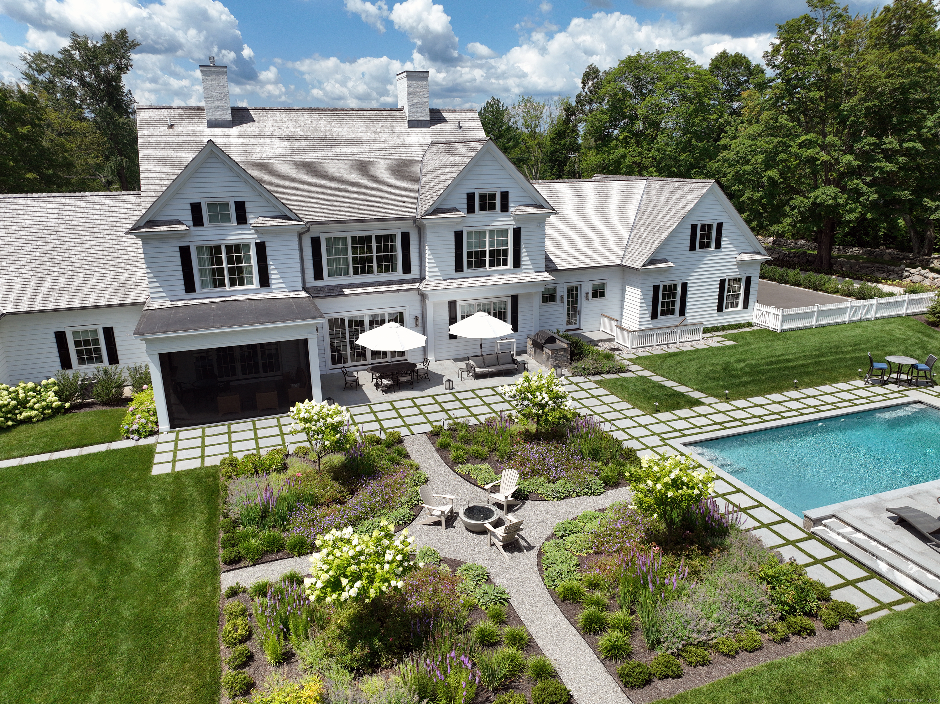 688 Hulls Farm Road Fairfield, CT 06890 - Photo 15 of 18 a aerial view of a house with a yard