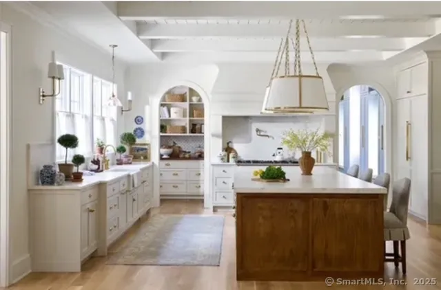 a kitchen with sink cabinets and window