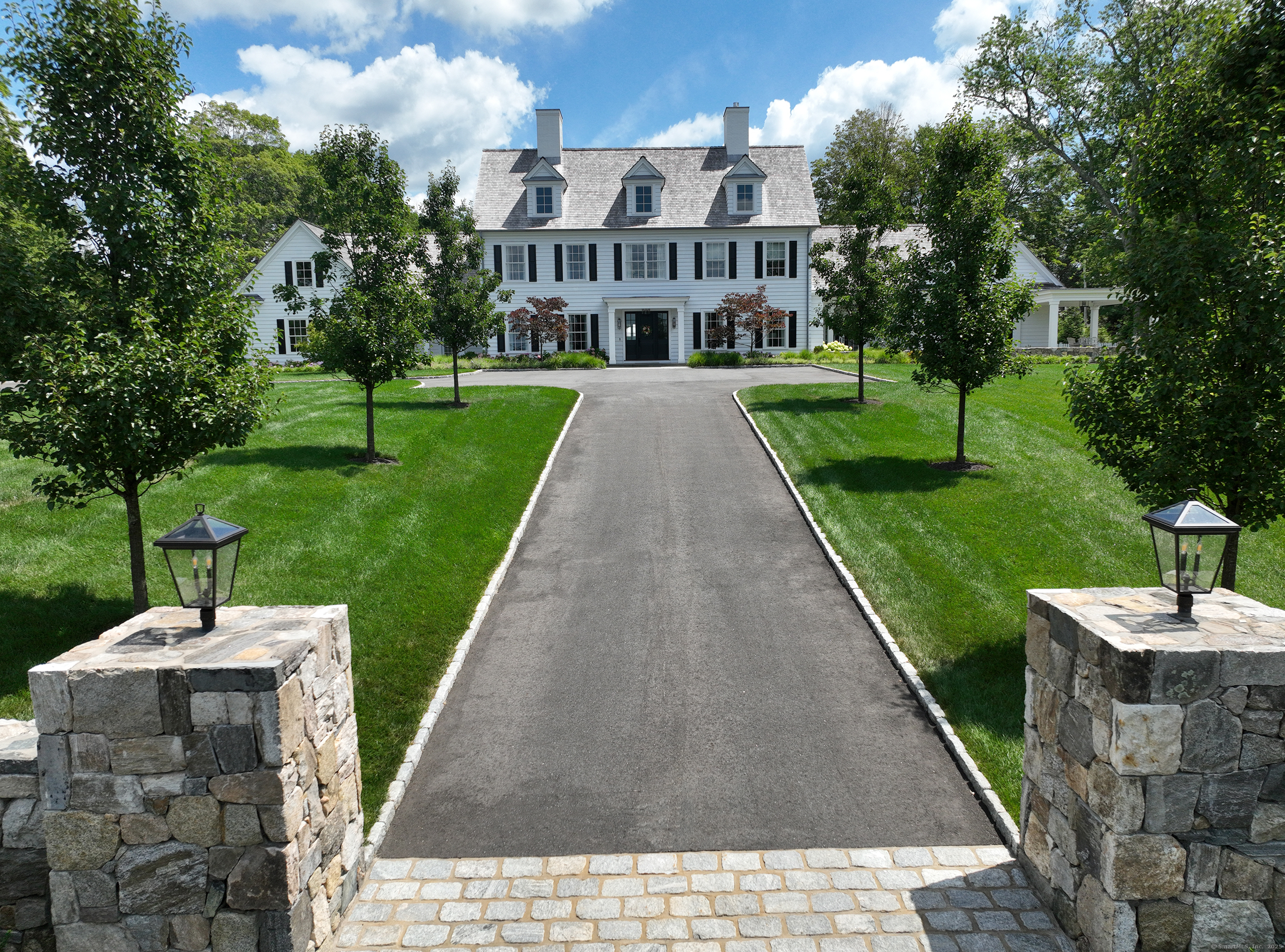 688 Hulls Farm Road Fairfield, CT 06890 - Photo 6 of 18 a view of a brick house with a yard