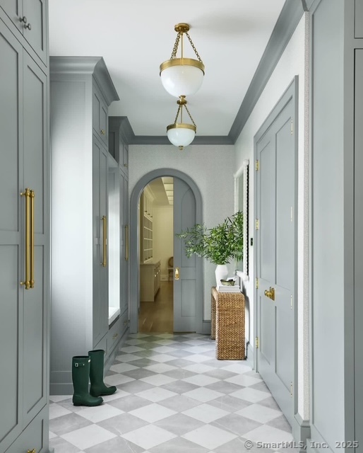 688 Hulls Farm Road Fairfield, CT 06890 - Photo 8 of 18 a view of entryway with a flower garden and chandelier