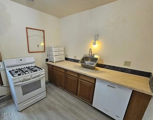 a kitchen with a stove and a sink