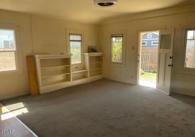 a view of empty room with windows