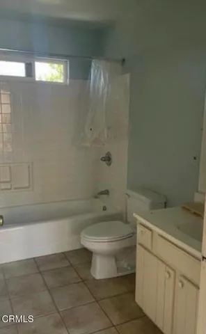 a bathroom with a toilet a sink and bathtub