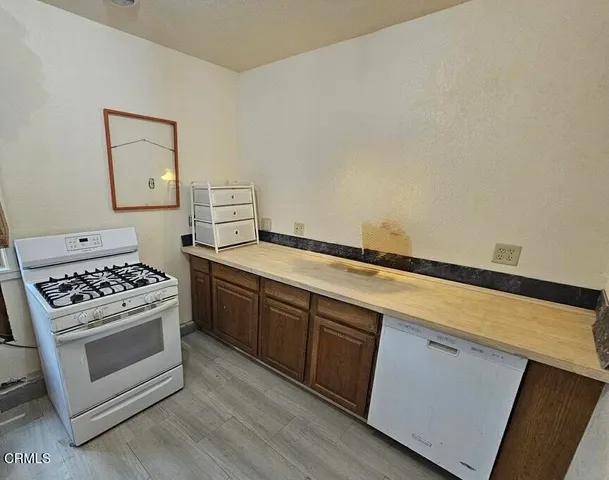 a kitchen with a stove and a sink