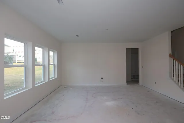 an empty room with windows