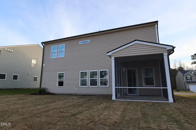 a front view of a house with a large window