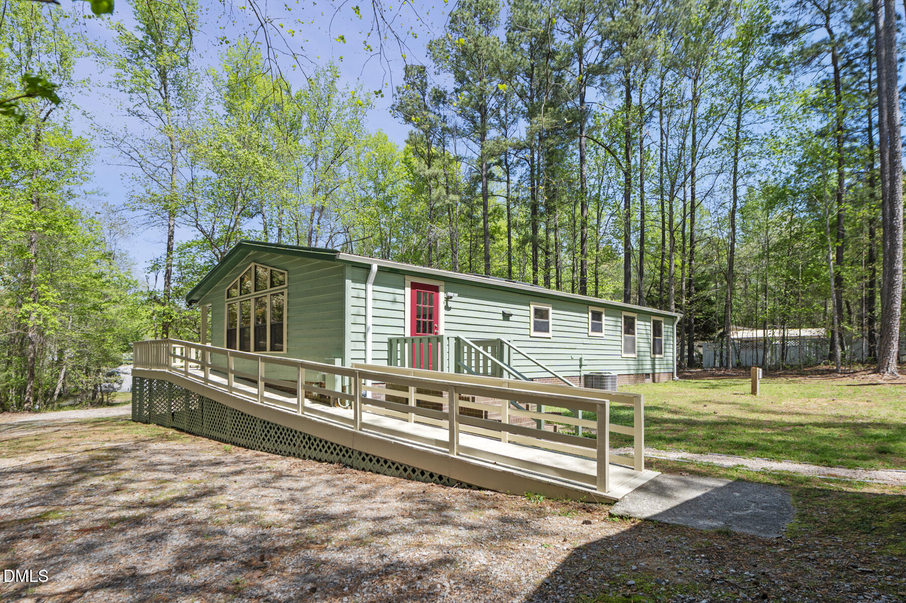 492 Little Mill Road Henderson, NC 27537 - Photo 27 of 39 a view of a wooden deck with a yard