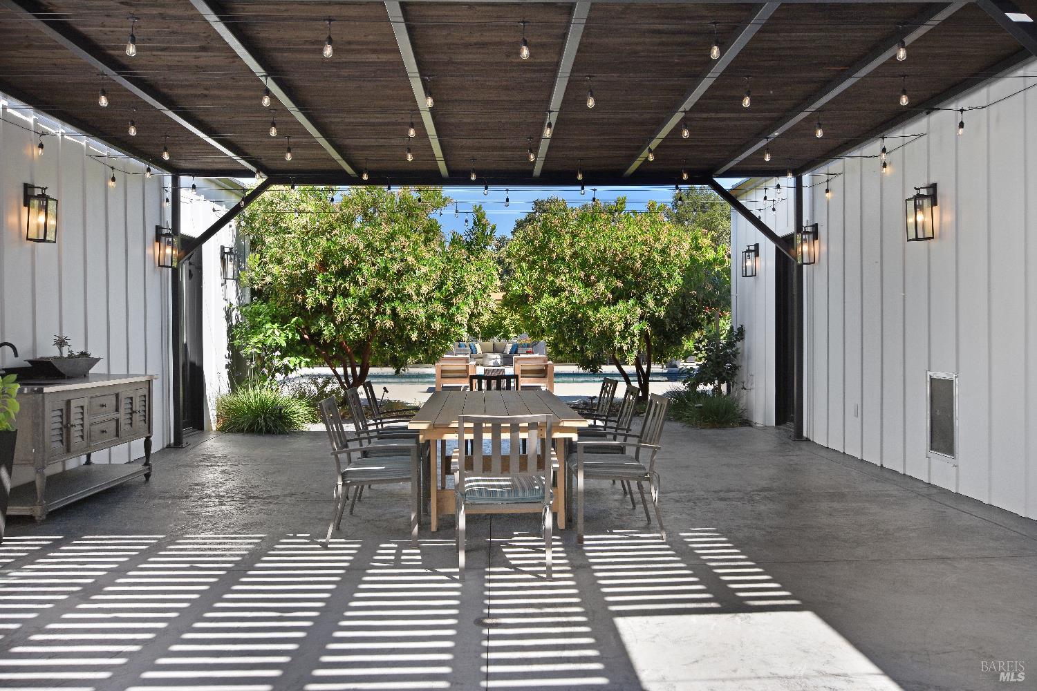 85 Trinity Road Glen Ellen, CA 95442 - Photo 38 of 62 a view of a patio with table and chairs and potted plants