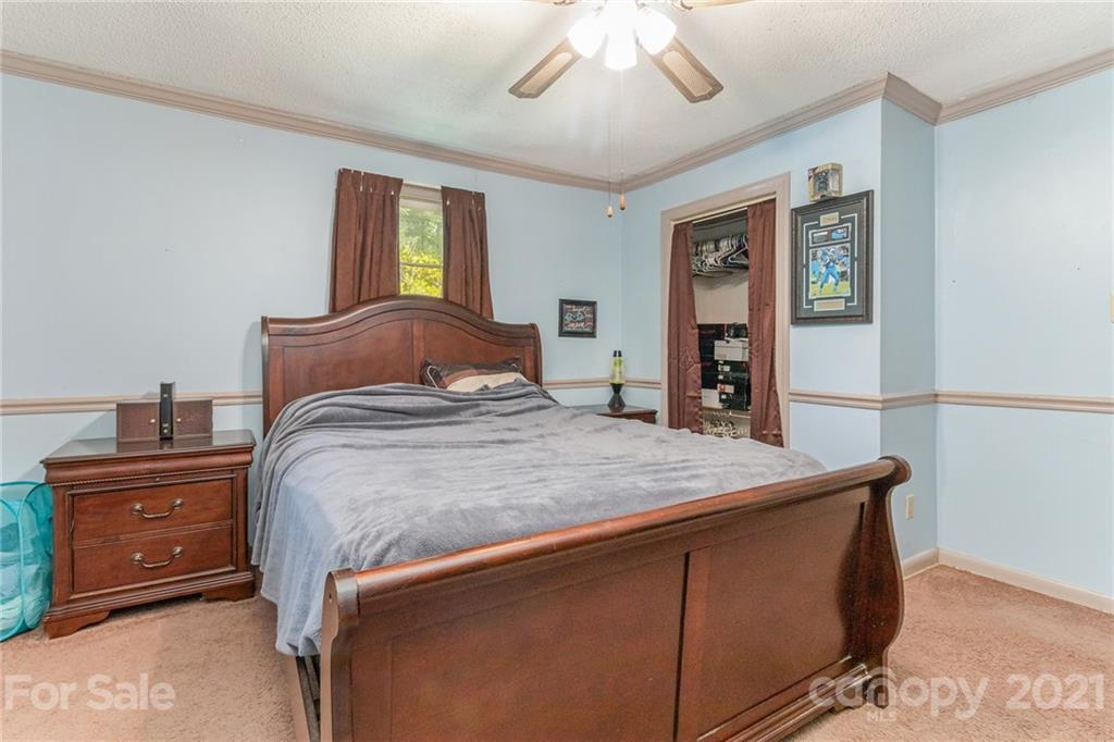 507 State Rd S-29-70 Lancaster, SC 29720 - Photo 12 of 27 a bedroom with a bed and a dresser