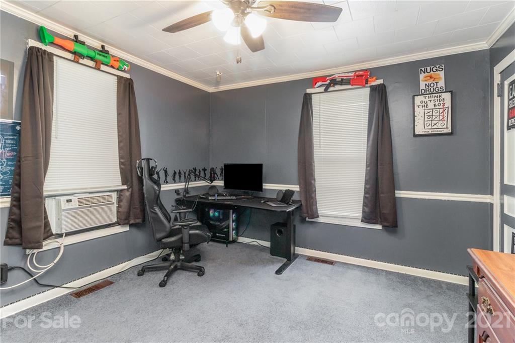 507 State Rd S-29-70 Lancaster, SC 29720 - Photo 15 of 27 a view of a workspace with furniture and a window