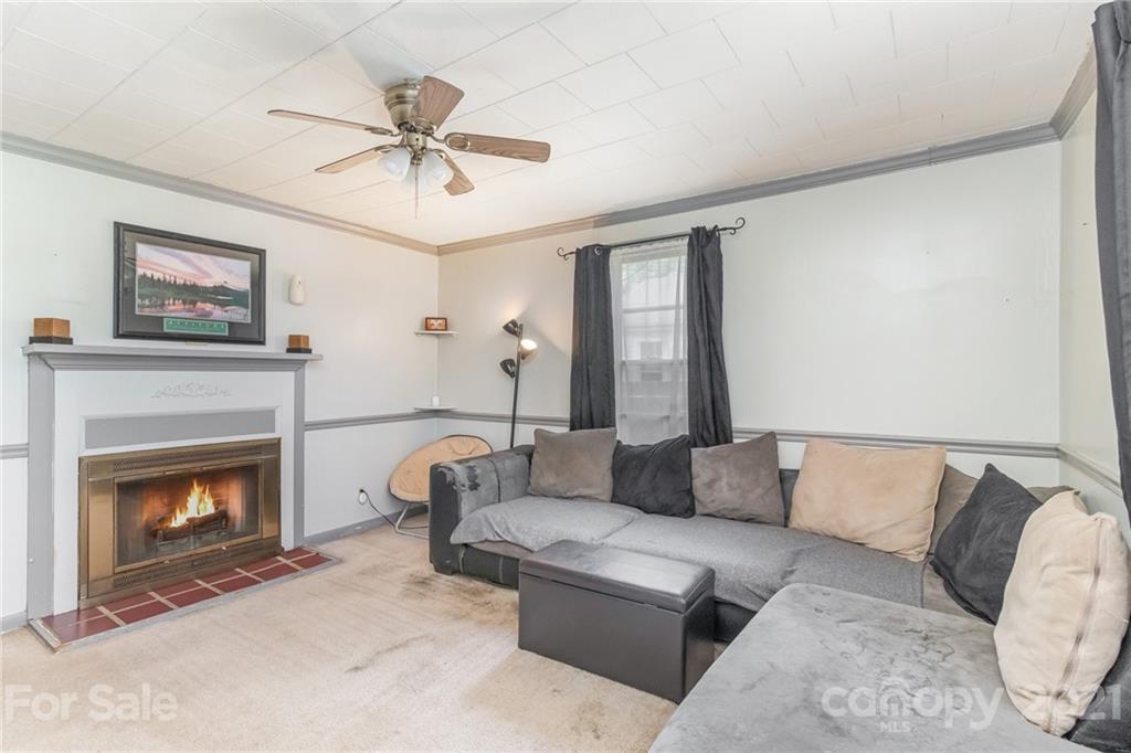 507 State Rd S-29-70 Lancaster, SC 29720 - Photo 3 of 27 a living room with furniture and a fireplace
