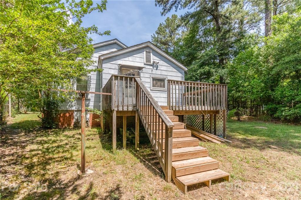507 State Rd S-29-70 Lancaster, SC 29720 - Photo 26 of 27 a view of a house with a small yard and wooden fence